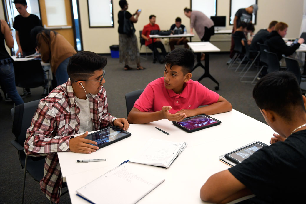  (Two 10th grade students talk in their film class at a high school in Aurora, Colorado.)