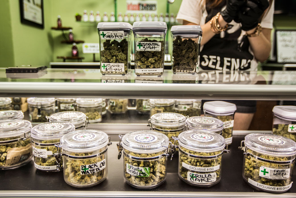 Preparations begin on the first day of the legalization of recreational marijuana sales in California, January 2018. (Containers of marijuana for sale on display counter)