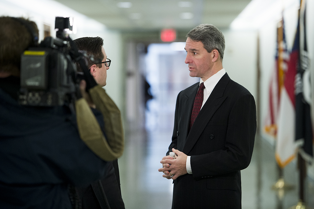 Ken Cuccinelli,
former Virginia attorney general, does a TV interview before a congressional subcommittee hearing on gun control, January 2015. (Getty/Bill Clark)