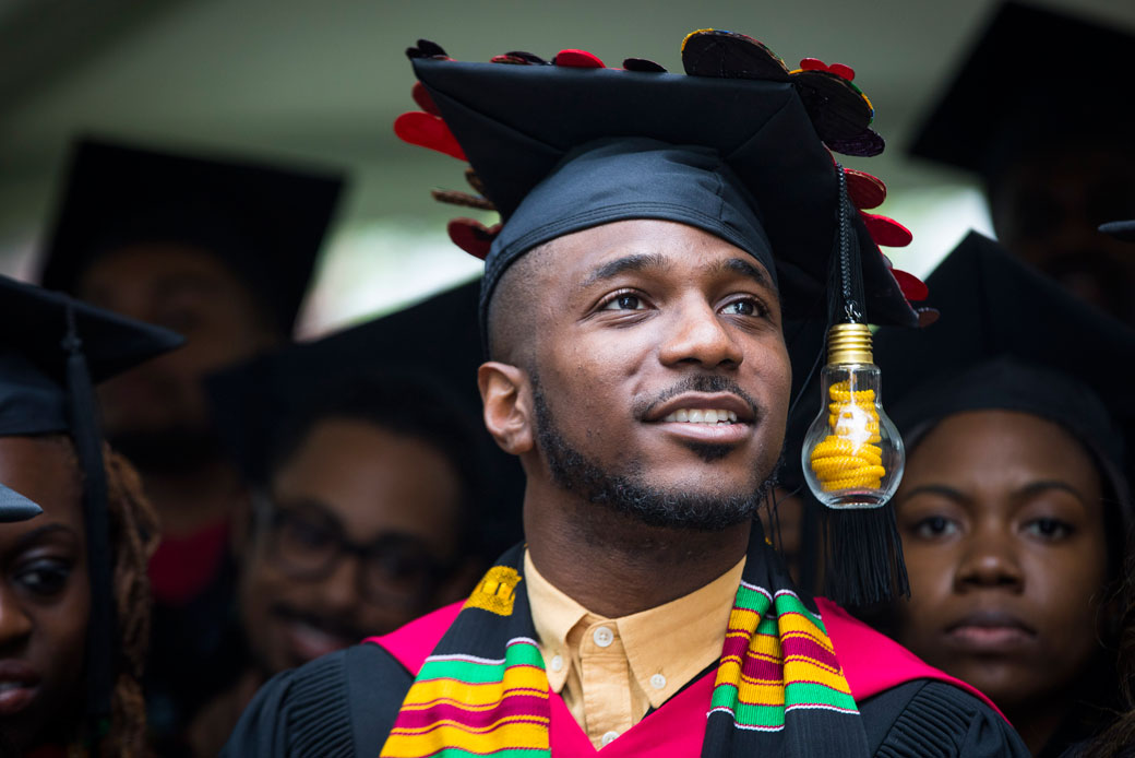 A master's degree graduate listens to speakers during a commencement ceremony at Harvard University, May 2017. (Getty/Keith Bedford)