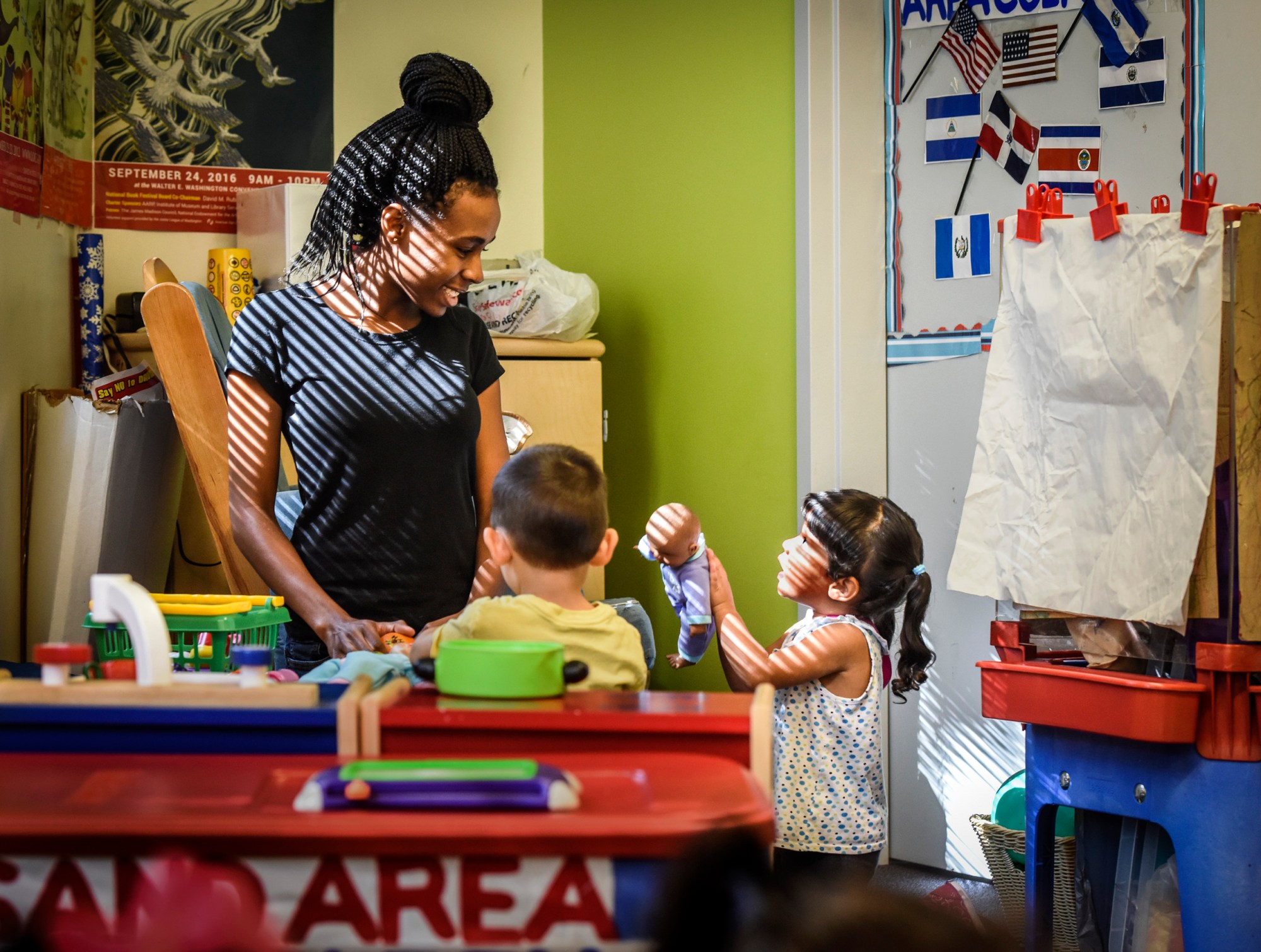Tyonna Stinnie, left, works toward her certification at a Child Development Center training for potential child care workers in Washington, D.C.. (Getty/ Bill O'Leary)