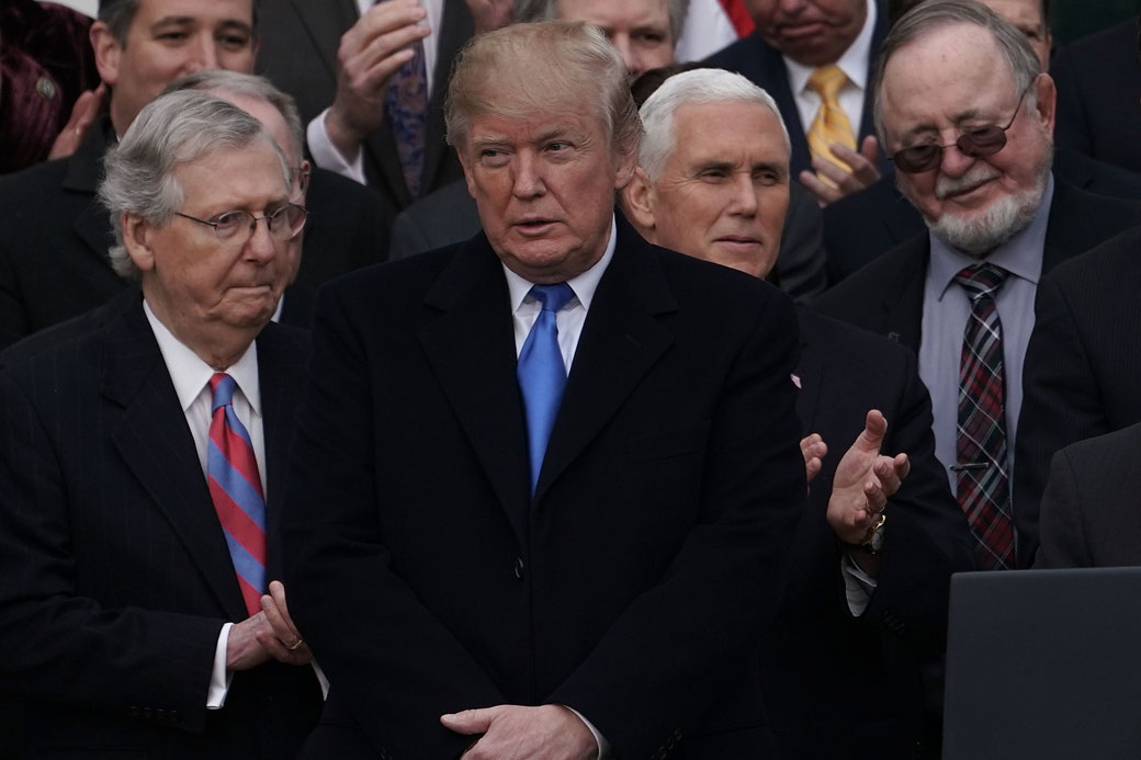 President Donald Trump and congressional Republicans celebrate the passage of the Tax Cuts and Jobs Act at the White House in Washington, D.C., December 2017. (Getty/Alex Wong)