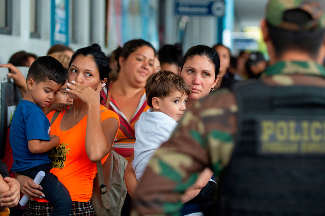 Venezuelan migrants wait for refugee applications at the Peruvian border in Tumbes on June 14, 2019. (Getty/AFP/Cris Bouroncle)
