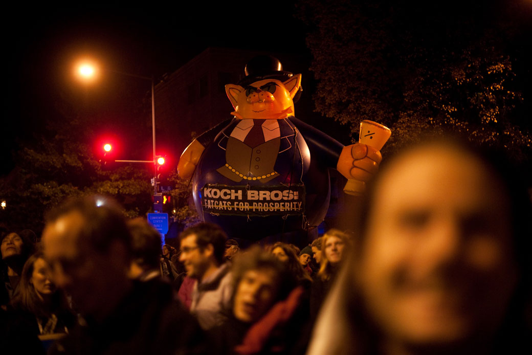 Protesters march near the Walter E. Washington Convention Center in Washington, D.C., during a November 2011 demonstration against the Koch brothers and Americans for Prosperity. (Getty/AFP/Nicholas Kamm)