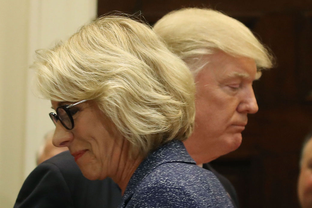 President Donald Trump and U.S. Secretary of Education Betsy DeVos are pictured in the Roosevelt Room at the White House, Washington, D.C., April 2017. (Getty/Mark Wilson)