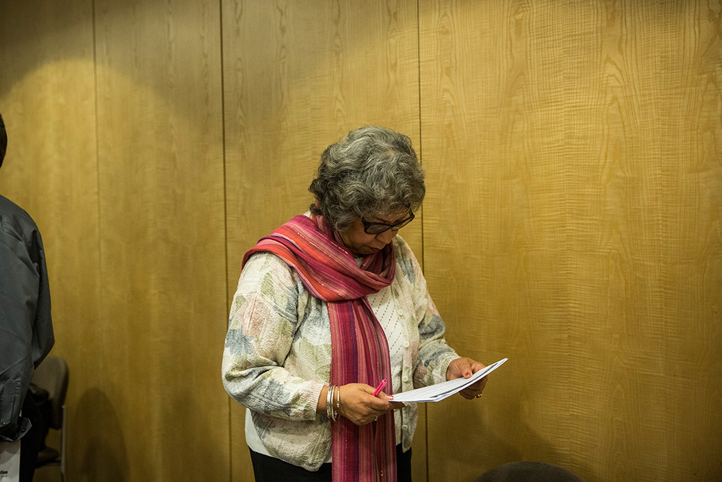 A woman prepares to speak to potential employers, November 2013, in New York City. (Getty/Andrew Burton)