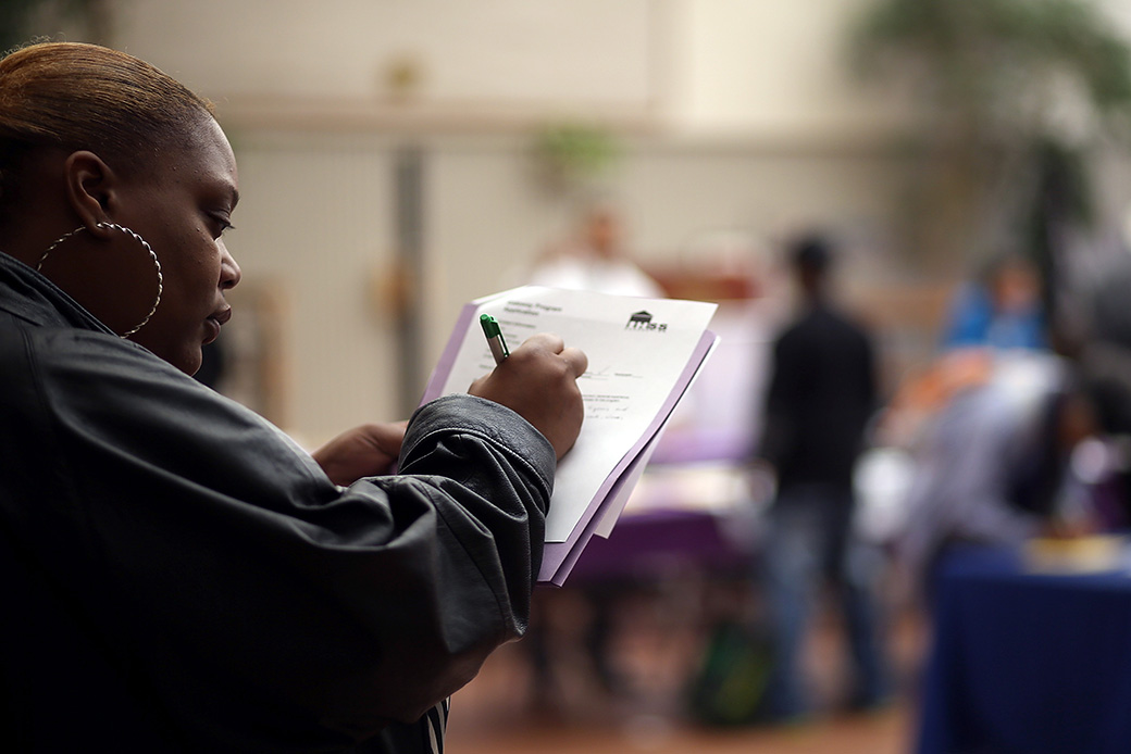 SAN FRANCISCO, CA - MAY 21:  A job seeker fills out an application during a career fair at the Southeast Community Facility Commission on May 21, 2014 in San Francisco, California. Job seekers came out in force looking for employment from nearly 40 employers at the second annual job and career fair in San Francisco's Bayview district. California's unemployment fell to 7.8 percent in April, down from 9.1 percent in April of 2013. (Photo by Justin Sullivan/Getty Images)