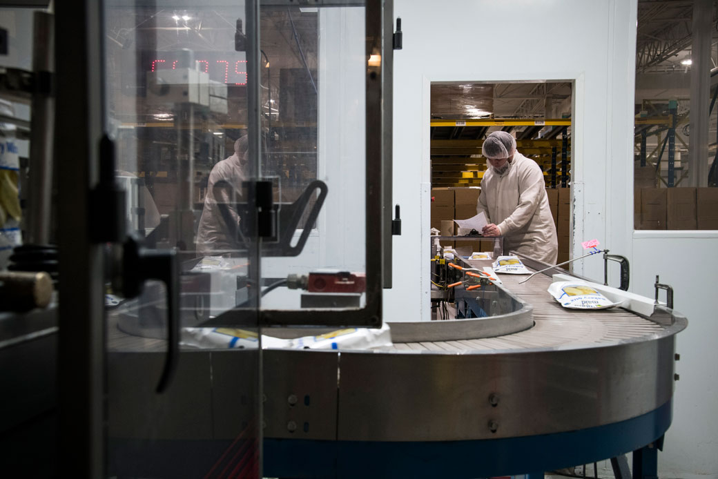  (A worker monitors a production line for a government contractor in North Carolina on January 11, 2019.)