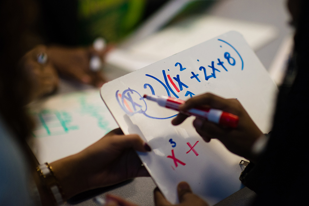 A high school student is tutored in algebra in Washington, D.C., April 2019. (Getty/Sarah L. Voisin)