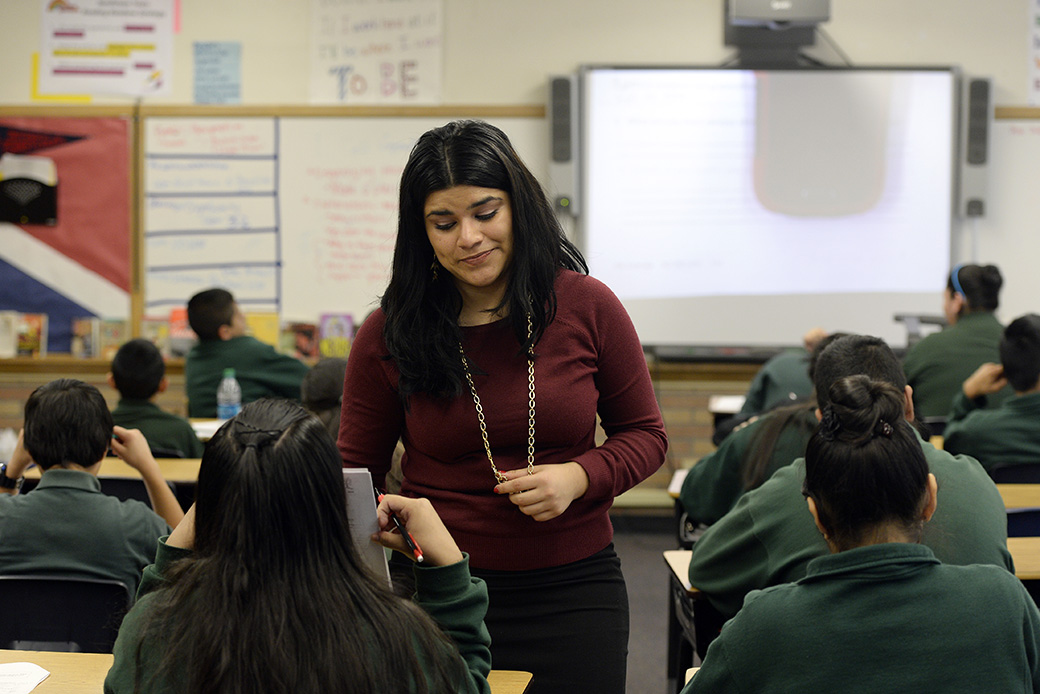 A seventh-grade English teacher and DACA recipient works with her students in Denver, December 2014. (Getty/Cyrus McCrimmon)