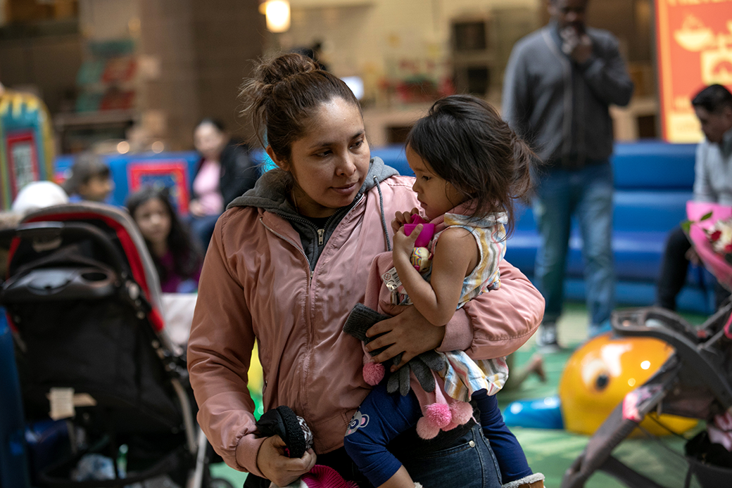 A Honduran asylum-seeker holds her daughter at an indoor play space in the greater Washington, D.C. area. (A Honduran asylum-seeker holds her daughter at an indoor play space in the greater Washington, D.C. area.)