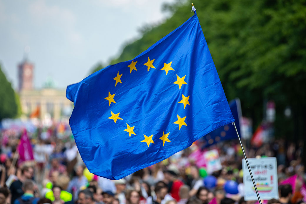  (A protestor waves the EU flag during a pro-Europe demonstration a week before European elections in Berlin, May 2019.)