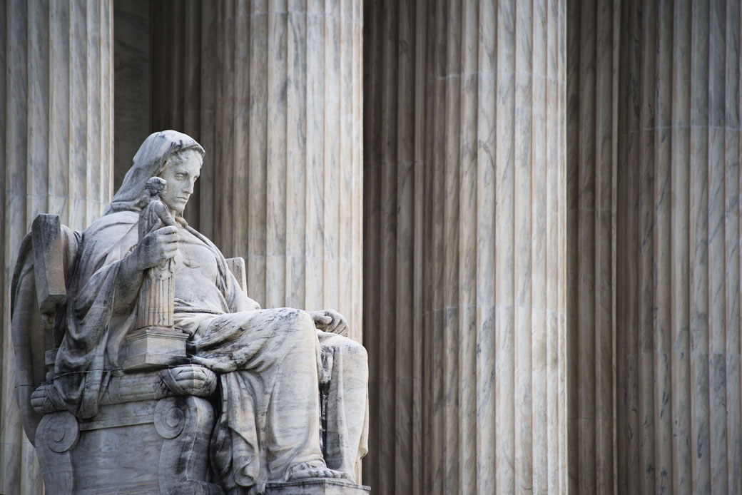 The Contemplation of Justice statue stands in front of the U.S. Supreme Court in Washington, D.C.