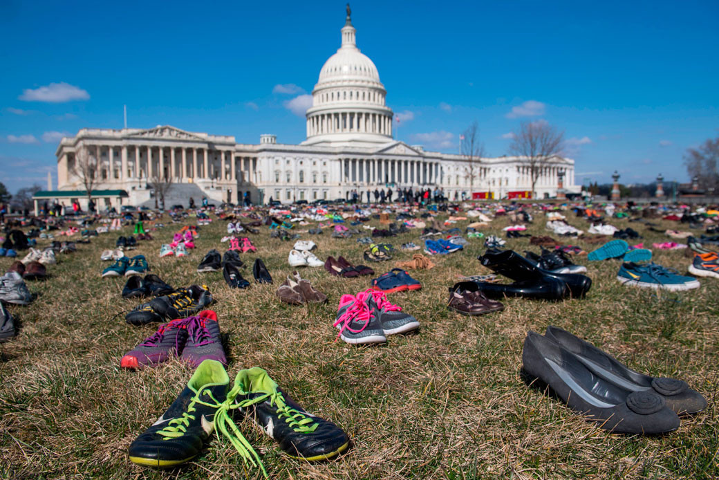 The lawn outside the U.S. Capitol is covered with 7,000 pairs of empty shoes on March 13, 2018 to memorialize the 7,000 children killed by gun violence since the Sandy Hook school shooting. (Getty/ Saul Loeb)