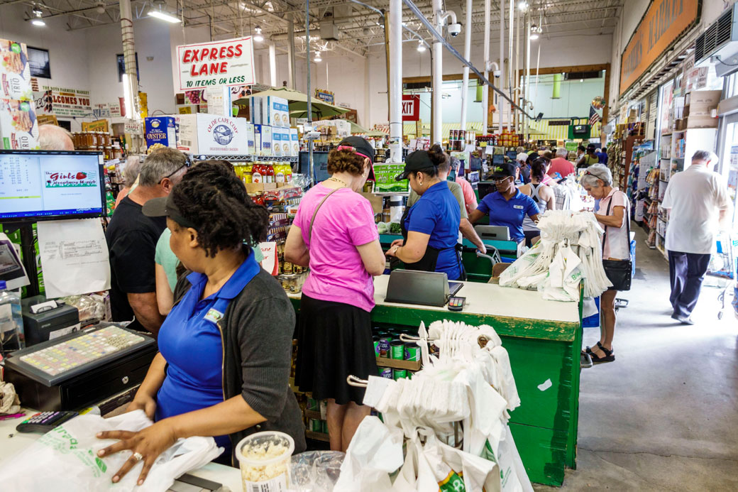 The check-out line at a market in Delray Beach, Florida, February 2018. (People stand in a check-out line)