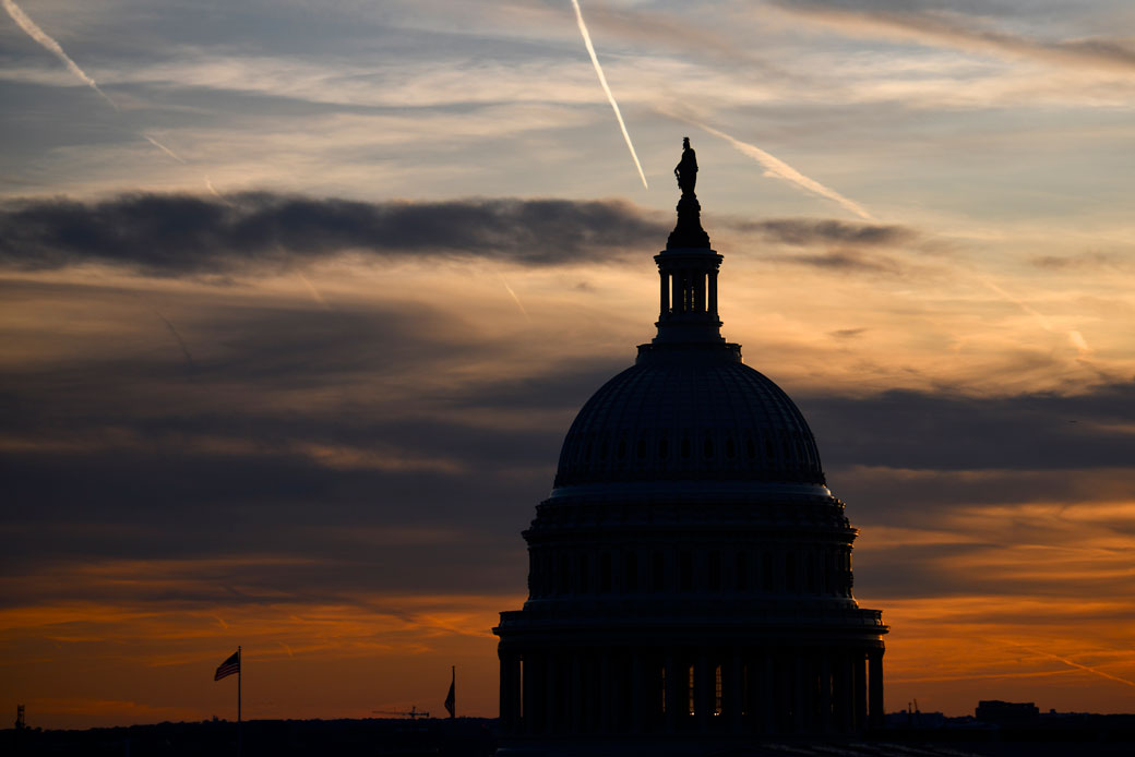 The sun sets over the U.S. Capitol dome, November 2019. (Getty/Mark Makela)