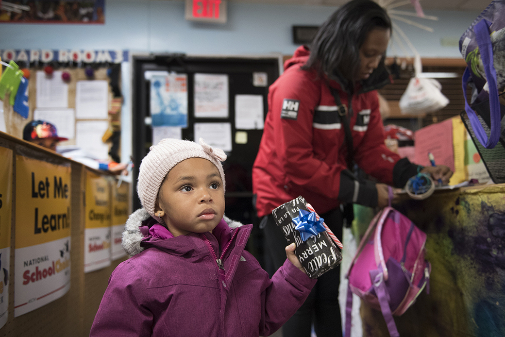 A single mother picks up her children from day care in Maryland on December 20, 2016. (Mother picks up children from day care)