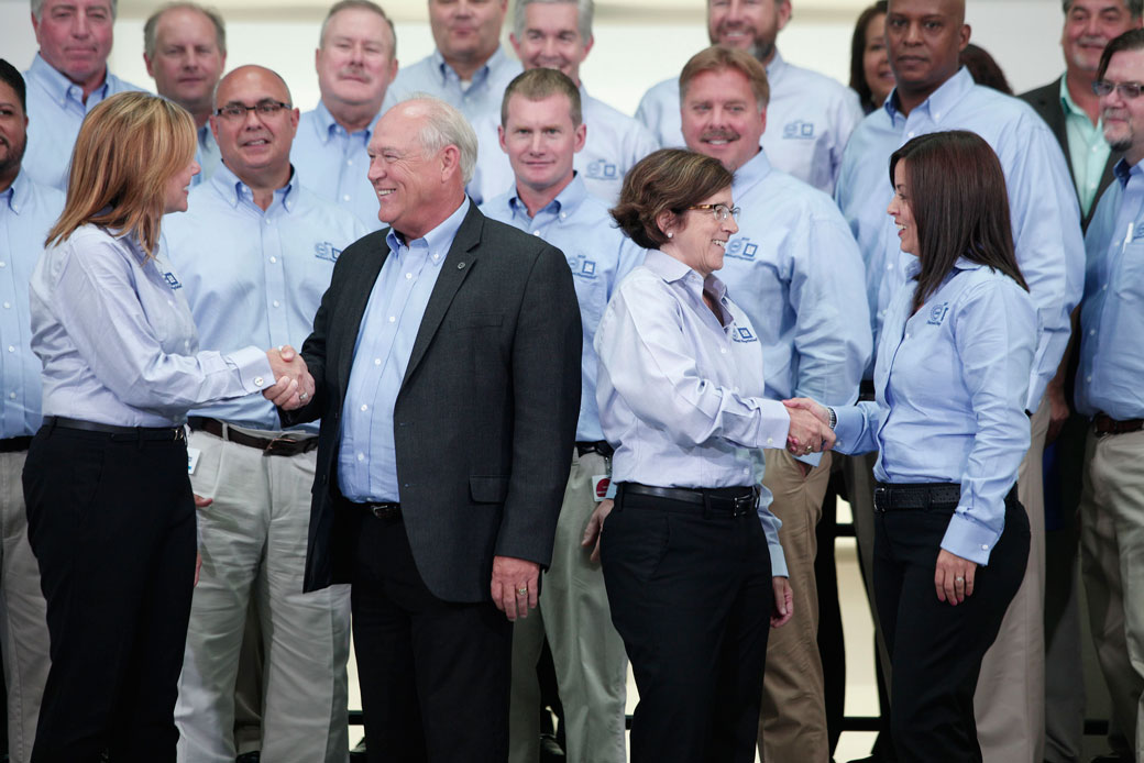 Leadership shake hands during union contract negotiations in Detroit, July 2015. (Leadership shake hands during union contract negotiations in Detroit, July 2015.)