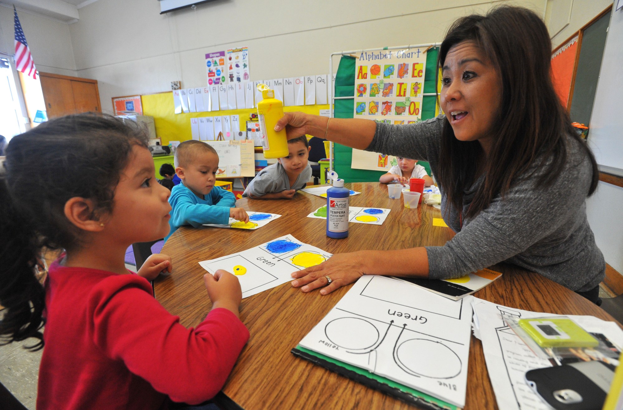 A teacher works with several students at a learning center in Long Beach, California, October 2013. (Getty/Digital First Media/Torrance Daily News/Scott Varley)