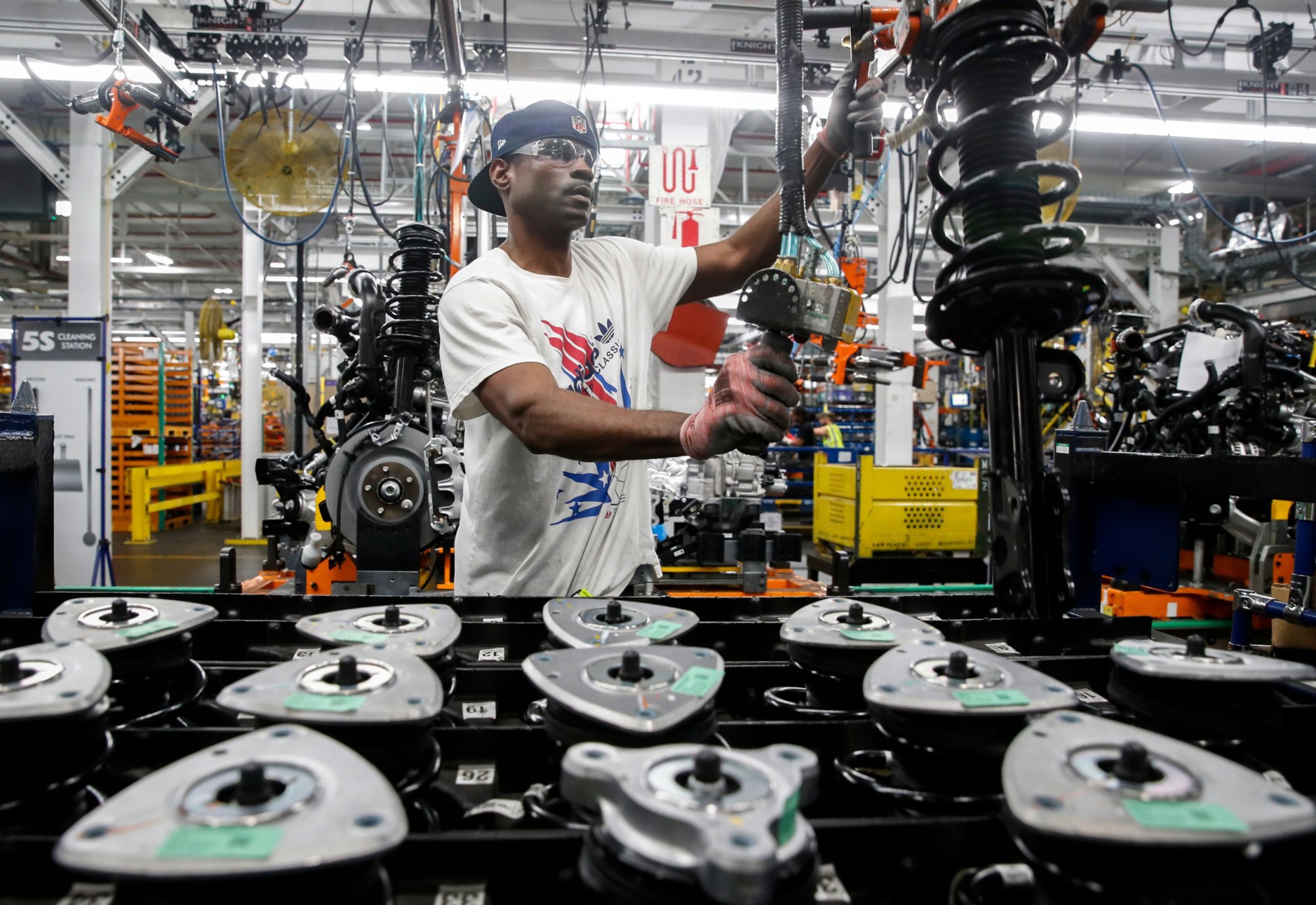 A worker assembles cars at the newly renovated Ford's Assembly Plant in Chicago in June 2019. (Getty/Jim Young)