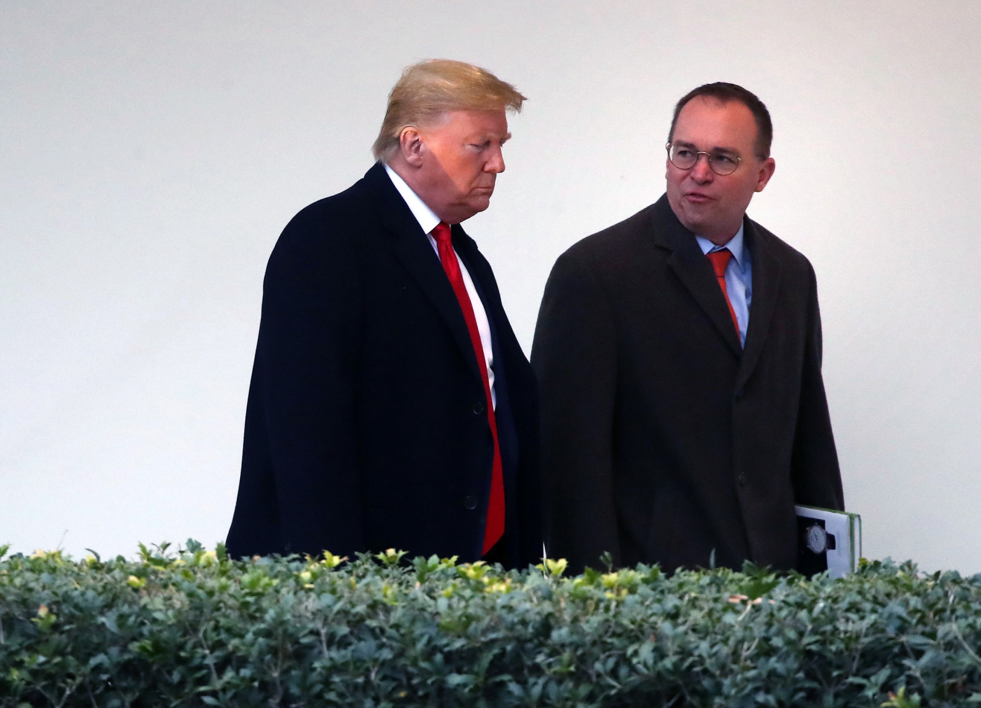 President Donald Trump walks along the West Wing Colonnade with acting White House chief of staff Mick Mulvaney, January 2020. (Getty/Mark Wilson)