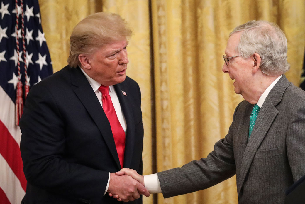 President Donald Trump shakes hands with Sen. Mitch McConnell during a November 2019 event about judicial confirmations at the White House, Washington, D.C. (Getty/Drew Angerer)