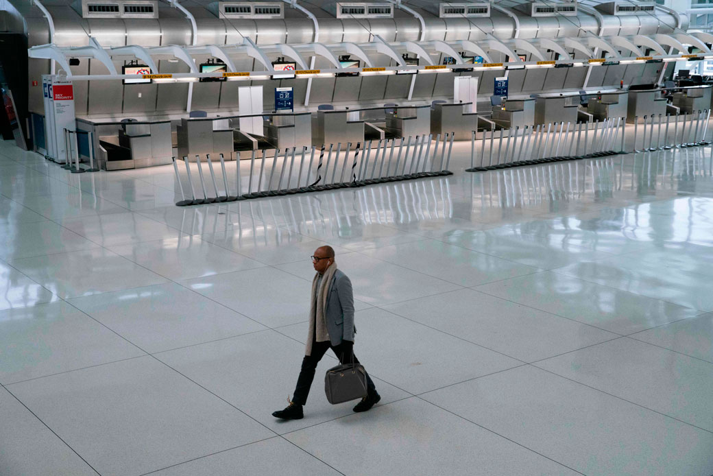 A man walks past a closed Air France counter at John F. Kennedy International Airport in New York City following President Trump's announcement of an EU travel ban on March 11, 2020. (Getty/AFP/Kena Betancur)