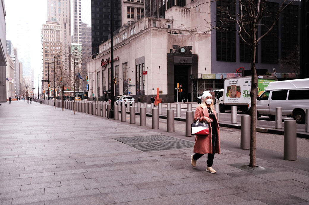People walk through the nearly empty streets in lower Manhattan, March 2020. (Getty/Spencer Platt)