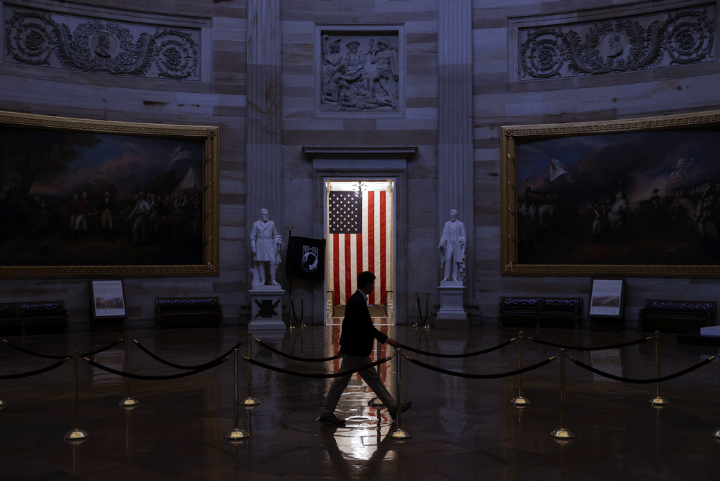 A man walks through the U.S. Capitol rotunda, which has been empty of tourists due to recent restrictions in response to the COVID-19 pandemic, Washington, D.C., March 2020. (Getty/Chip Somodevilla)