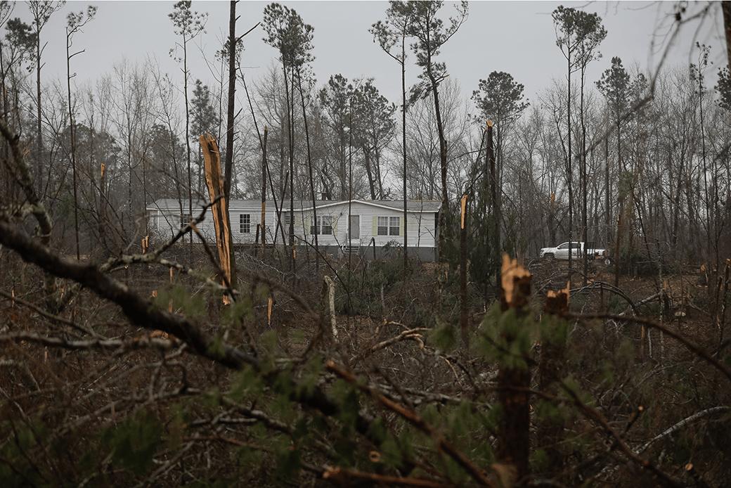 People work to clear fallen trees and debris after a tornado in Beauregard, Alabama, March 2019. (Getty/Elijah Jouvelage)