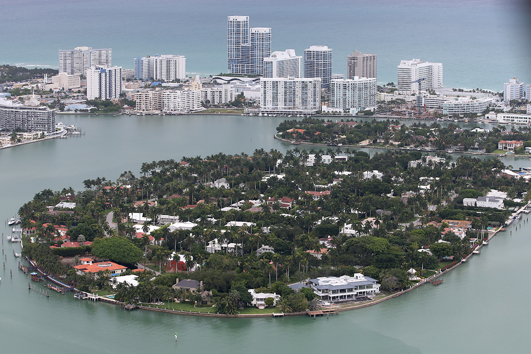 Single-family homes on islands and condo buildings on oceanfront property are seen in the city of Miami Beach, June 2014. (Getty/Joe Raedle)