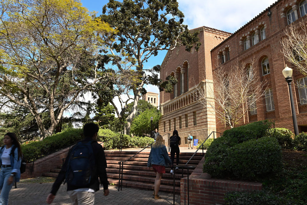 Students walk on a university campus in Los Angeles following the announcement that many Southern California universities would suspend in-person classes due to COVID-19 concerns, March 11, 2020. (Getty/AFP/Robyn Beck)