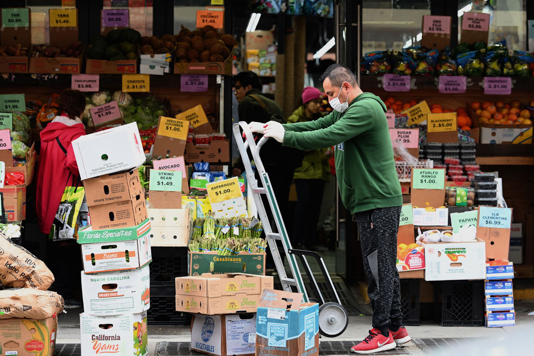 A worker stocks groceries at a local supermarket in Brooklyn, New York, on March 20, 2020. (Getty/Angela Weiss/AFP)