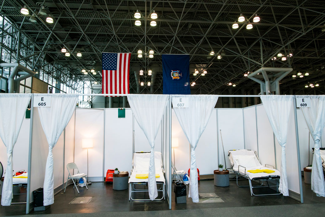 Hospital bed booths are set up at the Javits Center, which is being turned into a temporary hospital to help fight COVID-19 cases, in New York City on March 27, 2020. (Getty/Eduardo Munoz Alvarez)