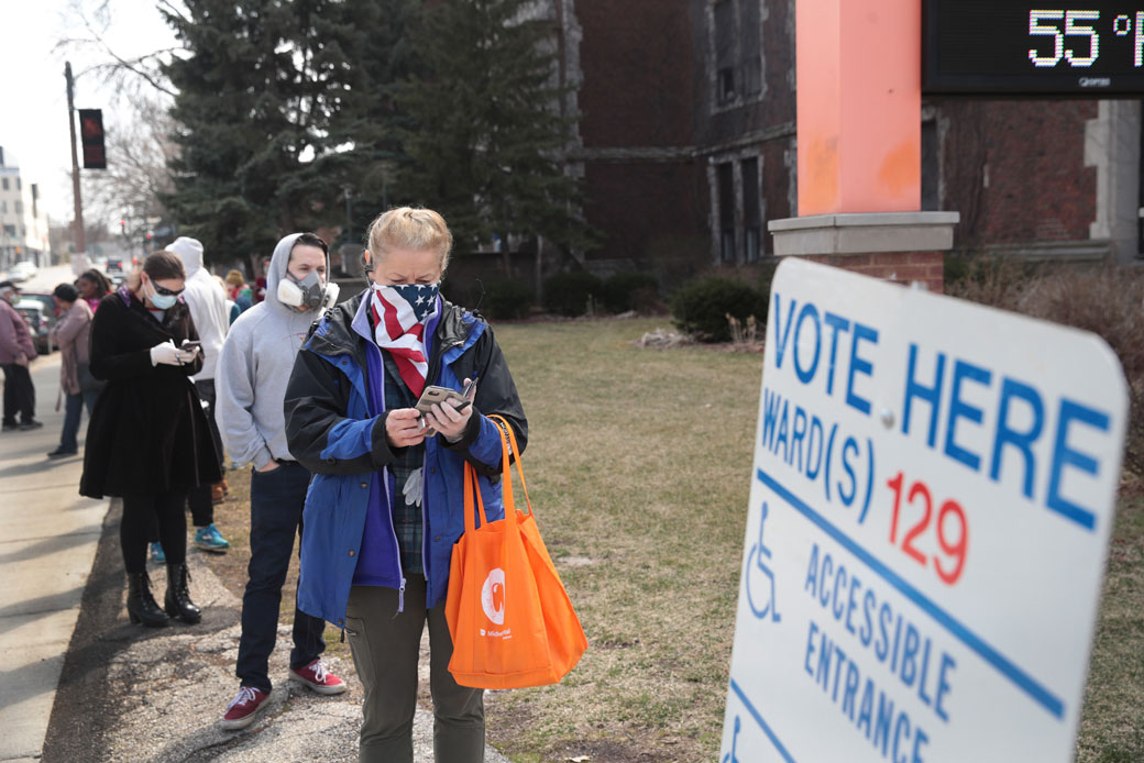 Voters wait in line to enter a polling location in Milwaukee on April 7, 2020. (Getty/Scott Olson)