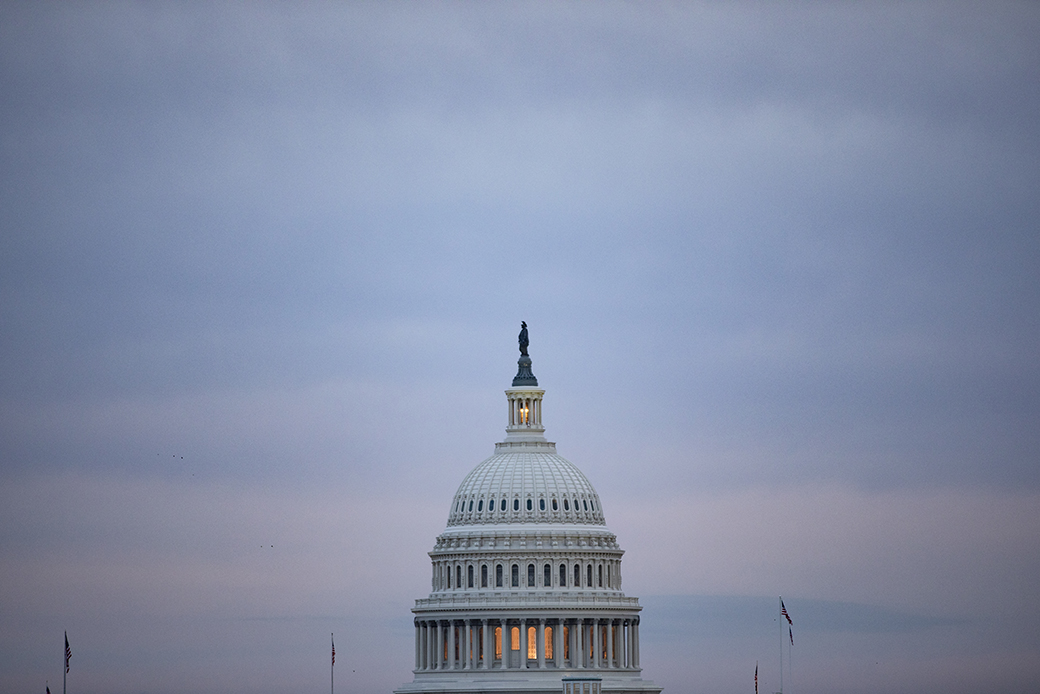 The sun sets over the U.S. Capitol in Washington, D.C., January 2020. (Getty/Samuel Corum)