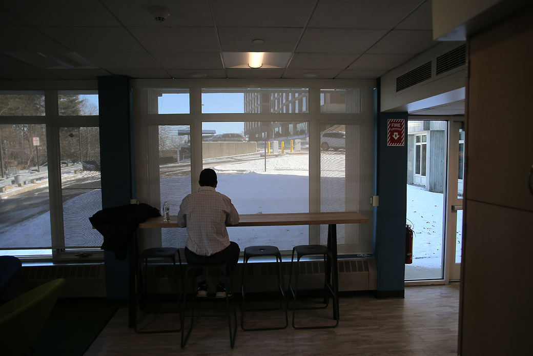 A student sits inside a campus building at his college in January 2019. (Getty/Lane Turner)