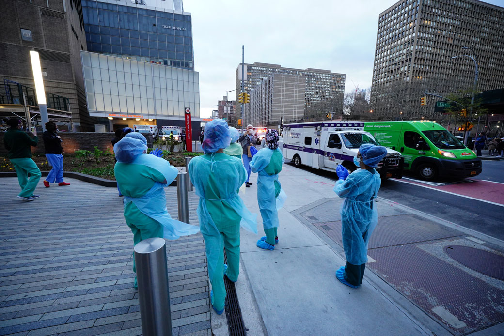 Frontline medical workers are applauded by New Yorkers as the city battles against the COVID-19 pandemic, April 2020. (Getty/NurPhoto/John Nacion)