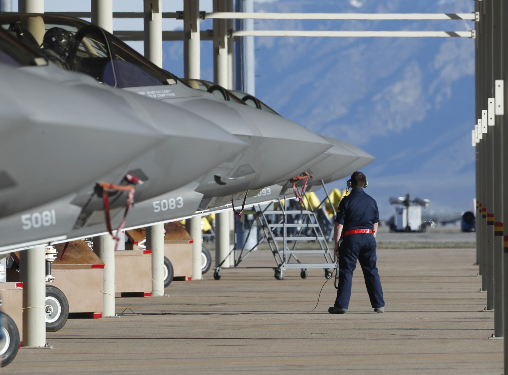 OGDEN, UT - MARCH 15: Ground crew members prepare an F-35 fighter jet for a training mission at Hill Air Force Base on March 15, 2017 in Ogden, Utah. Hill is the first Air Force base to get combat ready F-35's. They currently have 17 that might be deployed in the fight against terrorism and ISIS in the near future. (Photo by George Frey/Getty Images)