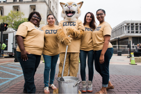 Central Louisiana Technical Community College staff and the college’s bobcat mascot attend a community event in downtown Alexandria.