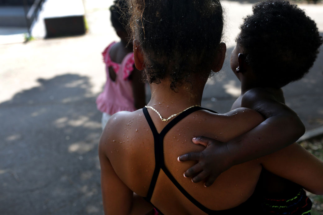 Children cool off at a park during a heat wave in Brooklyn, July 2019. (Getty/Yana Paskova)