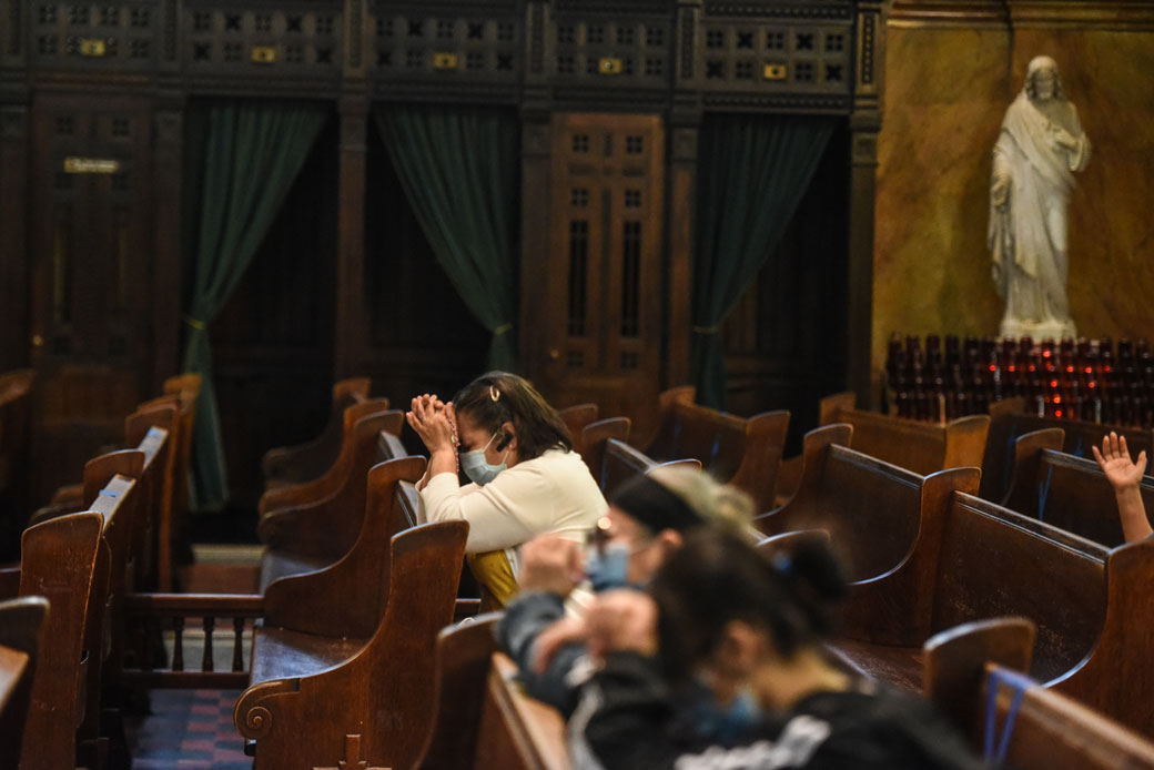 People pray inside of St. Michael's Church in the Sunset Park neighborhood in Brooklyn, May 2020. (Getty/Stephanie Keith)