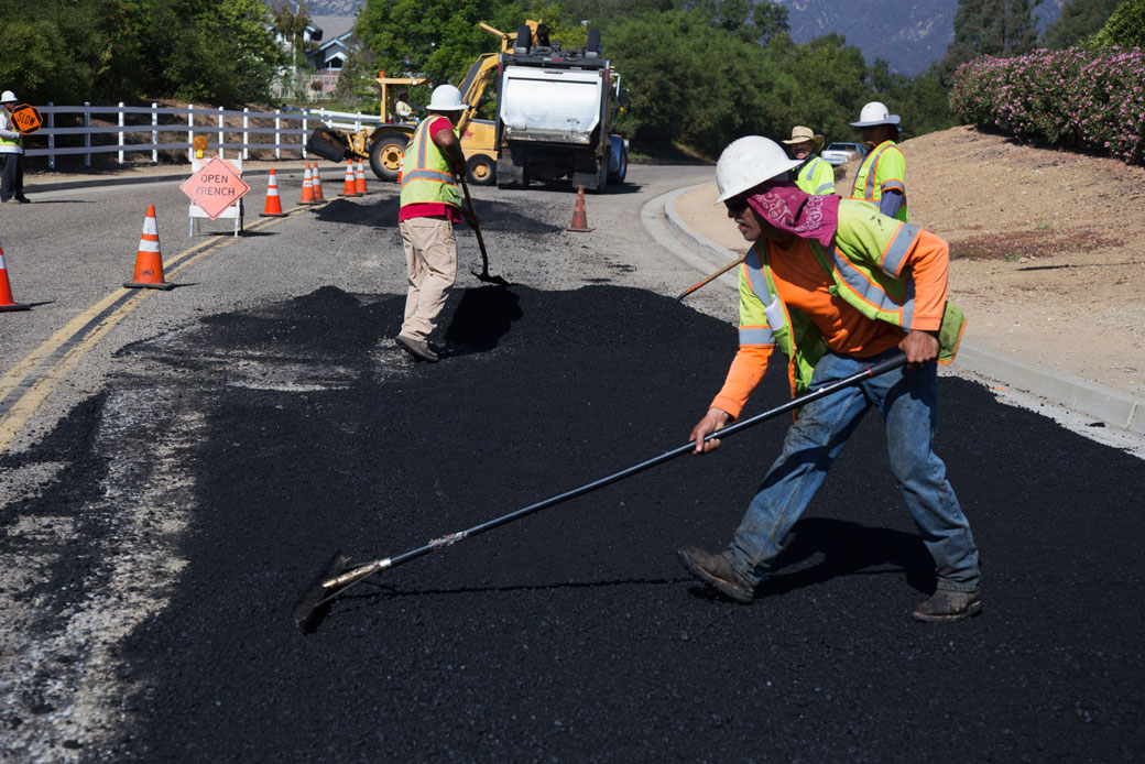 Workers repave a road in Oak View, California, October 2013. (Getty/Universal Images Group/Visions of America/Joe Sohm)