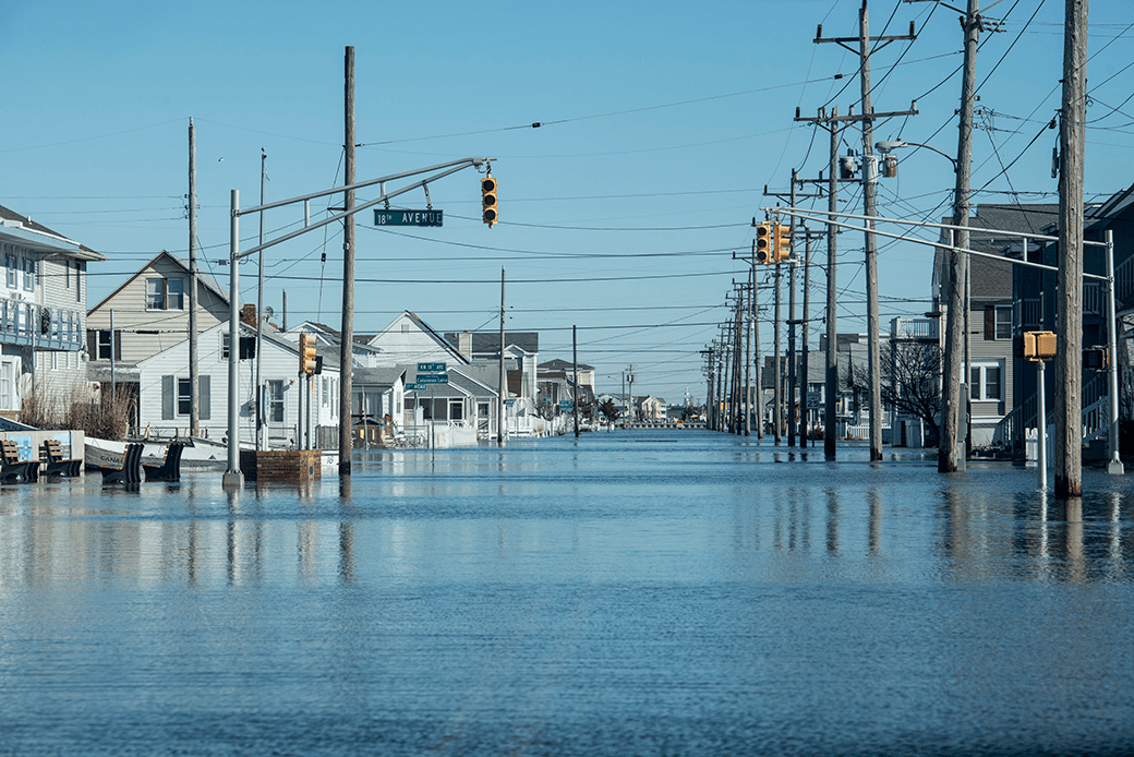  (View of a fully flooded street in bright daylight)