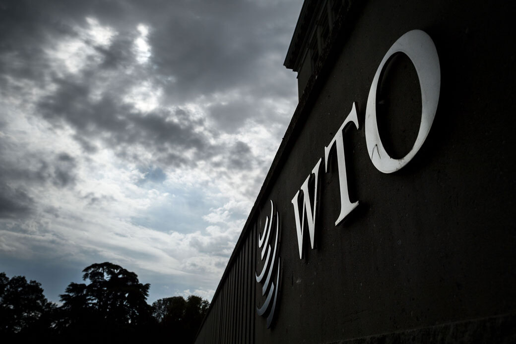 A sign of the World Trade Organization (WTO) is seen on their headquarters in Geneva, September 2018. (Getty/Fabrice Coffrini)