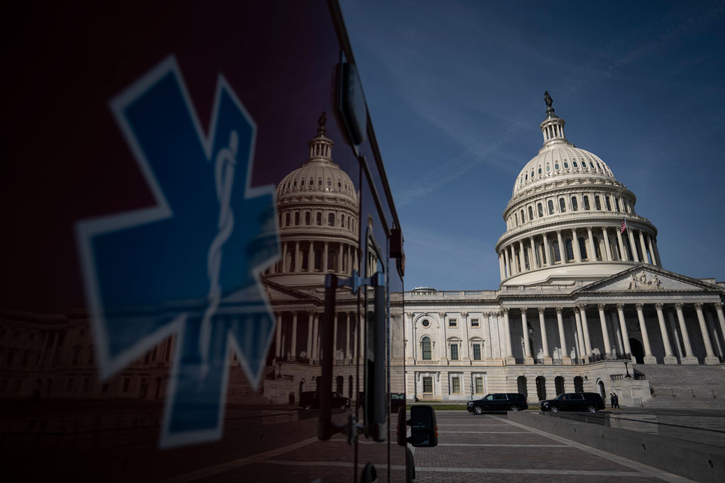 An ambulance sits parked outside the U.S. Capitol in Washington, D.C., March 2020. (Getty/Drew Angerer)