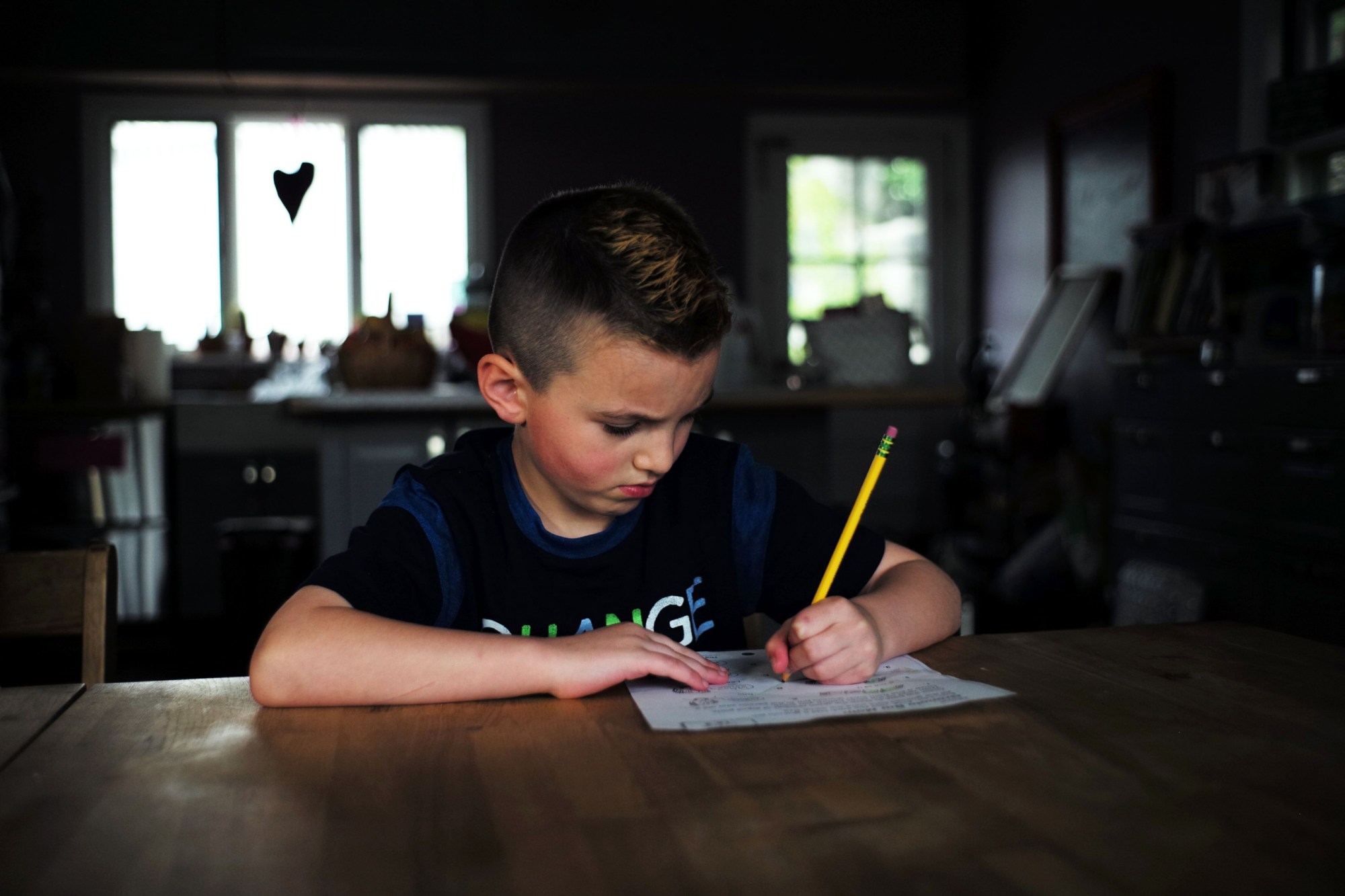 Seven-year-old transgender boy Jacob Lemay does his homework at his home in Melrose, Massachusetts, on May 9, 2017. 
For months in the Lemay home, the same phrase was repeated over and over by their troubled young child, barely more than a toddler, who showed growing signs of depression. 