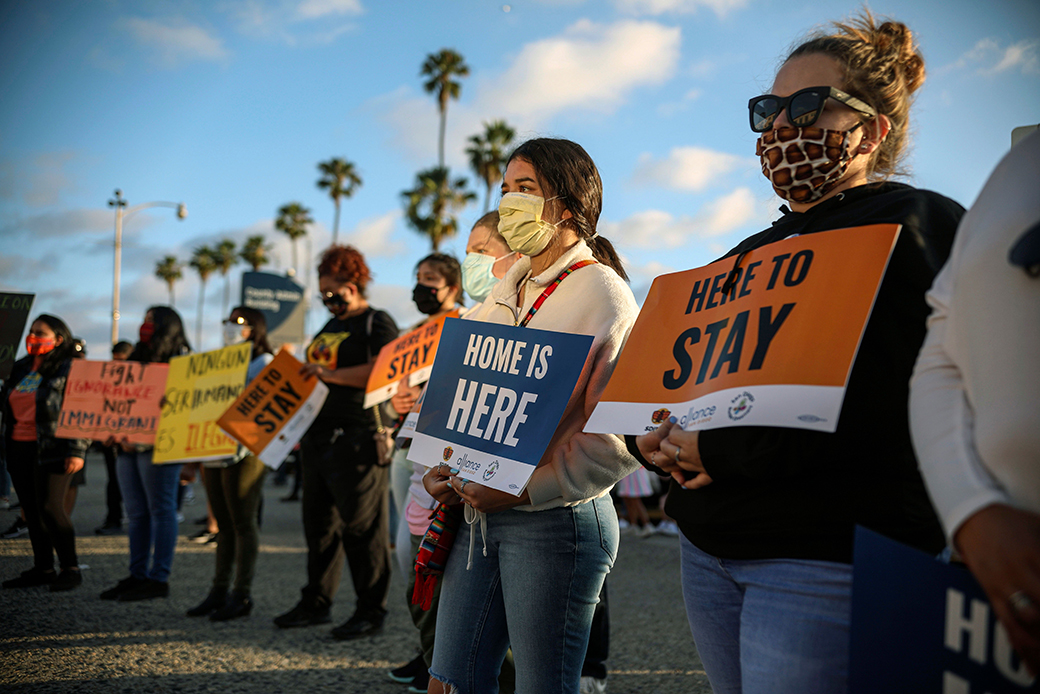 People hold signs during a rally in support of the U.S. Supreme Court's ruling in favor of Deferred Action for Childhood Arrivals, in San Diego, June 18, 2020. (Getty/Sandy Huffaker)