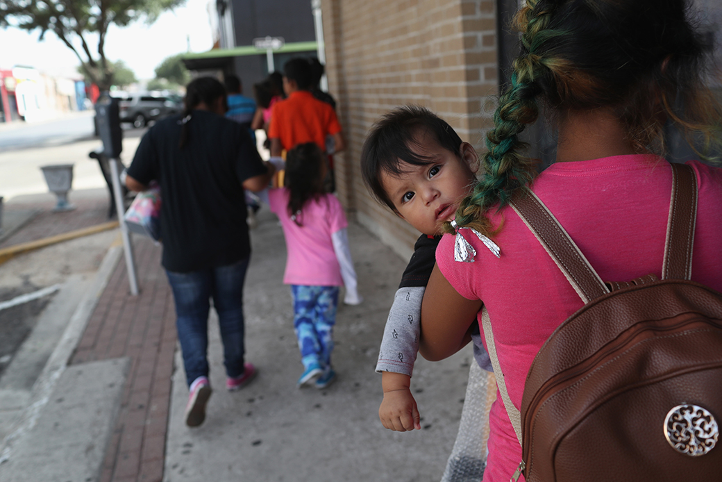 Central American immigrant families depart the custody of U.S. Immigration and Customs Enforcement, pending future immigration court hearings, June 2018, in Texas. (Getty/John Moore)