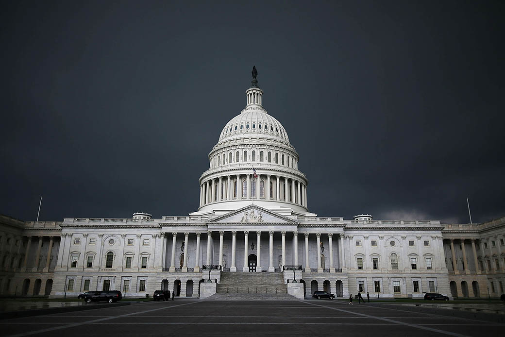 Storm clouds fill the sky over the U.S. Capitol Building, June 2013, in Washington, D.C. (Getty/Mark Wilson)